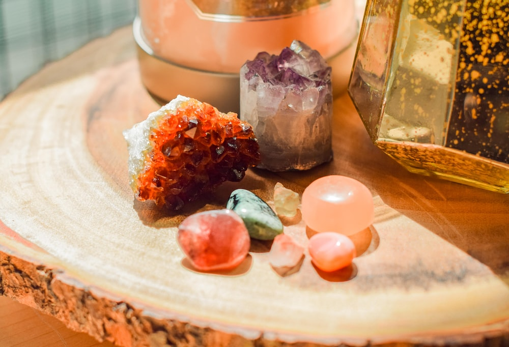 A live-edge table topped with assorted crystals and stones